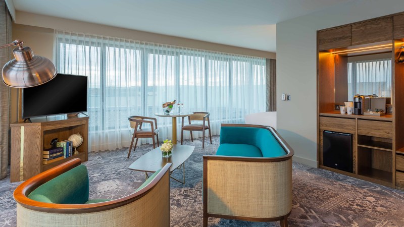 a room filled with furniture and a large window